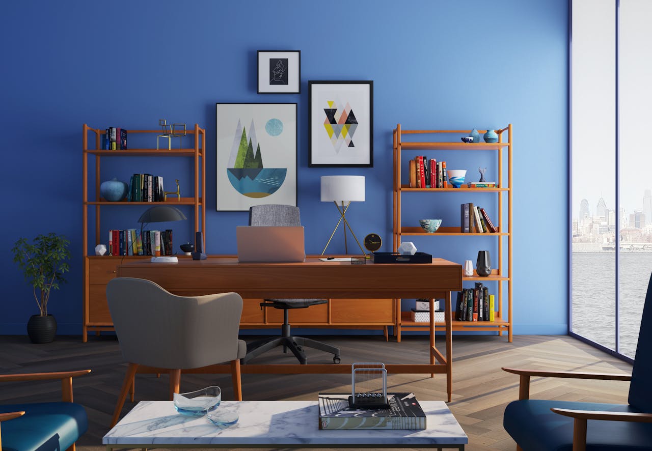 services-01 Elegantly decorated home office with modern furniture and a blue wall.